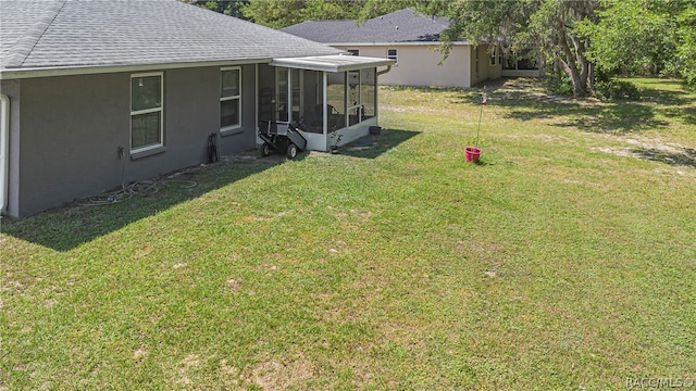 view of yard with a sunroom