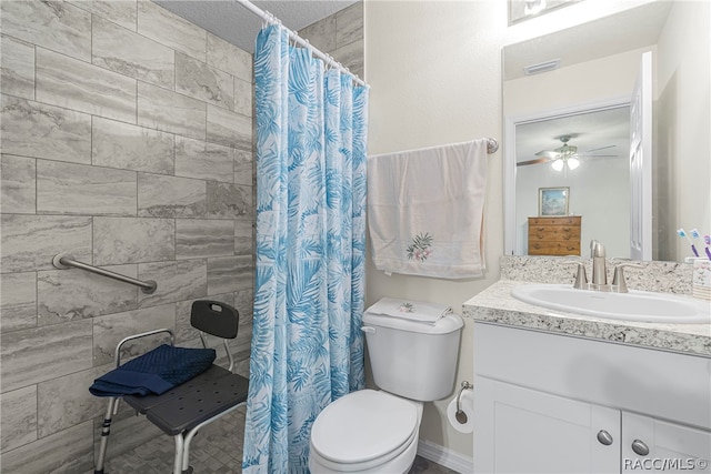 bathroom with vanity, ceiling fan, toilet, and curtained shower