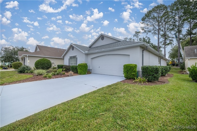 ranch-style home featuring a garage and a front lawn