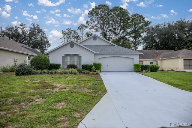 ranch-style house with a garage and a front yard