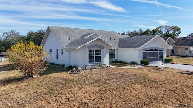 single story home featuring a front yard