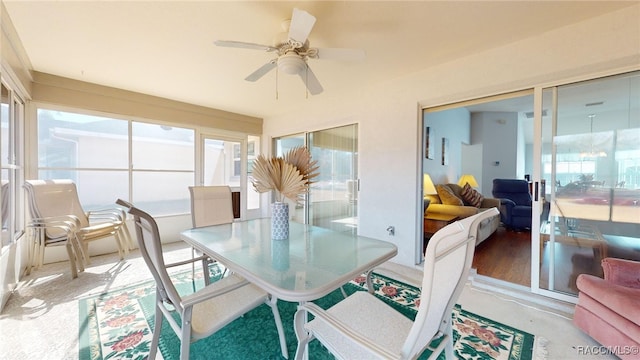 sunroom featuring a wealth of natural light and ceiling fan