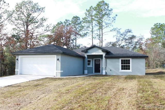 ranch-style home with a front yard and a garage