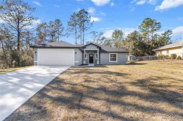 ranch-style house featuring a garage and a front lawn