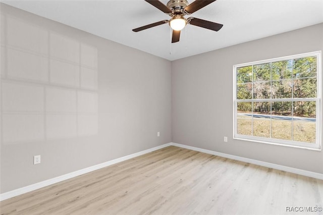 spare room with ceiling fan and light hardwood / wood-style flooring