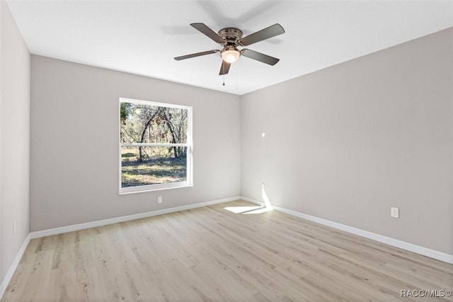 empty room with light hardwood / wood-style floors and ceiling fan