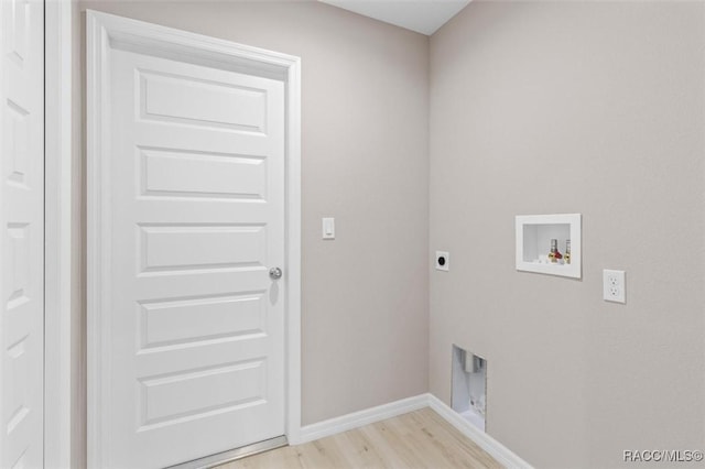 washroom featuring washer hookup, light hardwood / wood-style floors, and hookup for an electric dryer