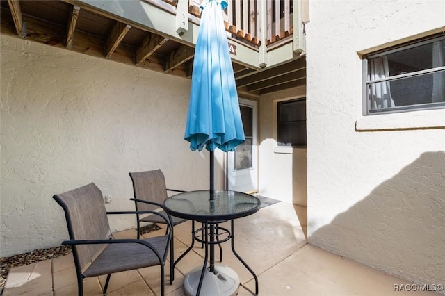 view of patio featuring a balcony