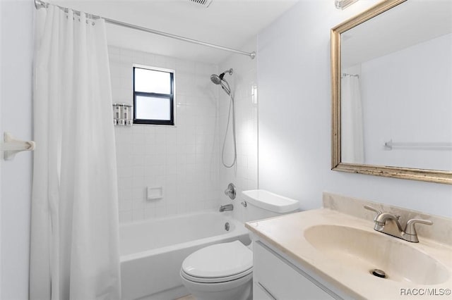 full bathroom featuring vanity, toilet, and shower / tub combo