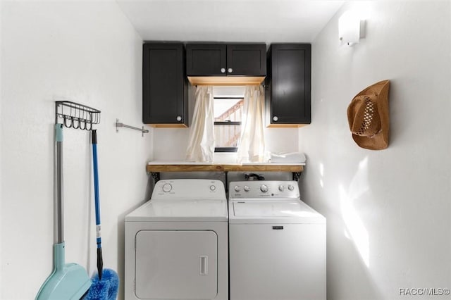 laundry room with cabinets and independent washer and dryer