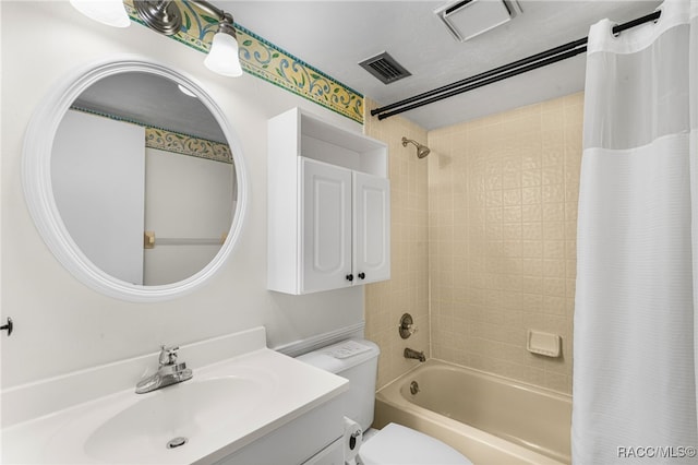 full bathroom with vanity, toilet, and shower / bath combo with shower curtain