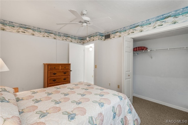 bedroom with a closet, ceiling fan, and carpet flooring