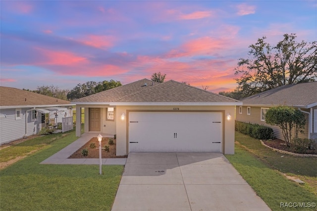 ranch-style home with a yard