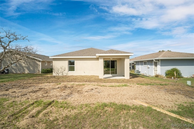 back of property with a patio area