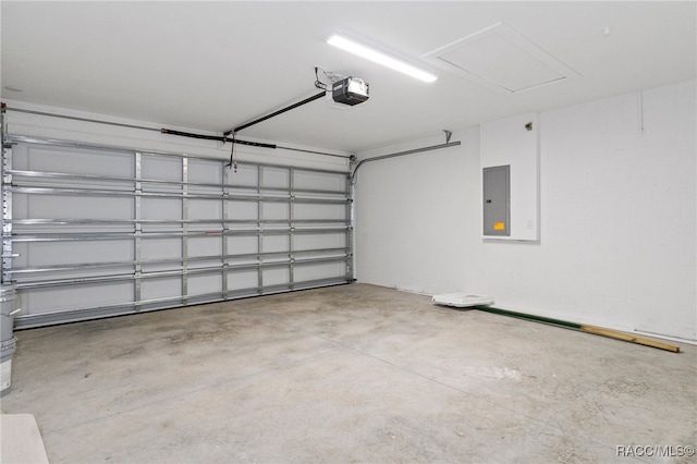 garage featuring a garage door opener and electric panel