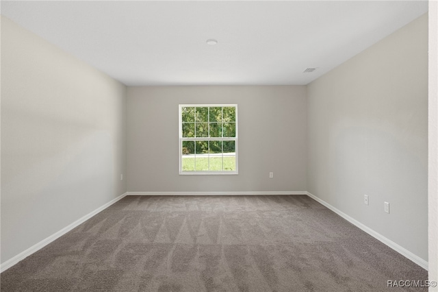 empty room with carpet flooring