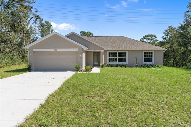 single story home with a front yard and a garage