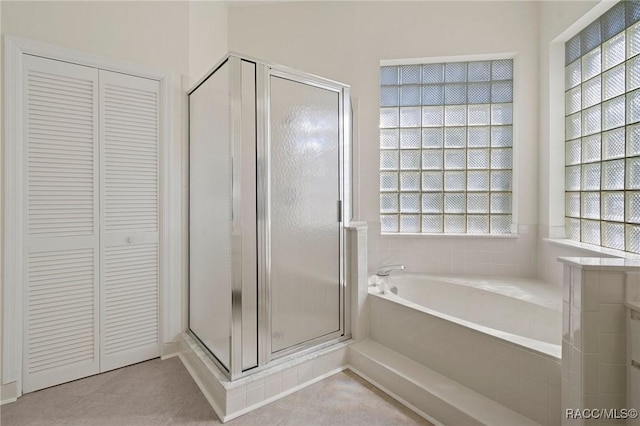 bathroom with separate shower and tub