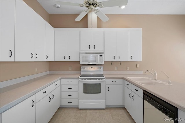 kitchen featuring white cabinets, white appliances, and sink