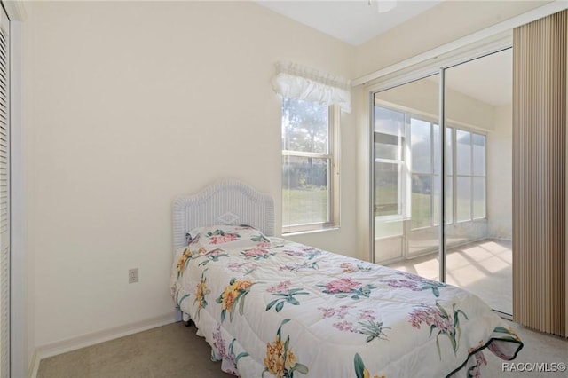 carpeted bedroom with a closet