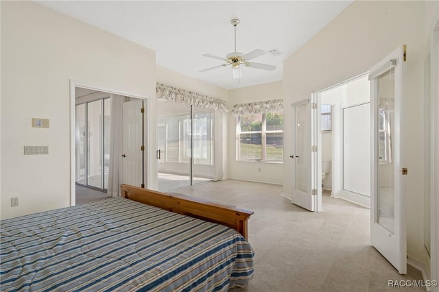 bedroom featuring light colored carpet and ceiling fan