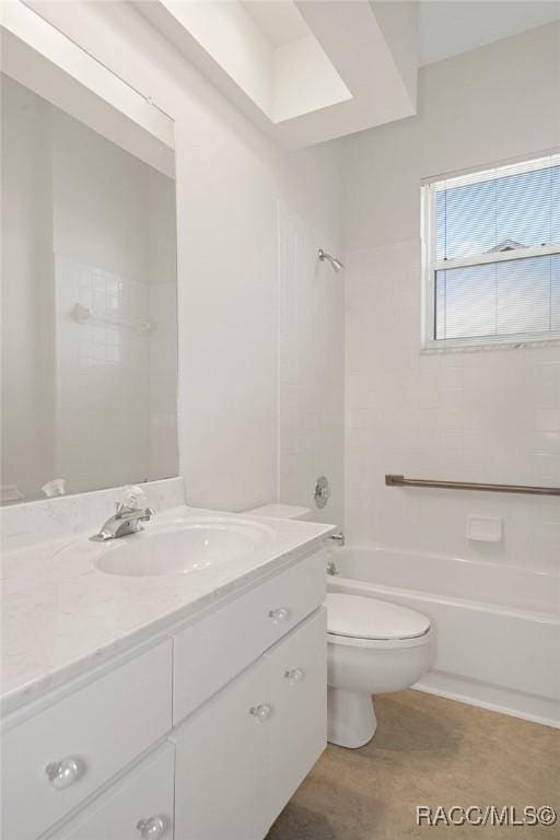 full bathroom featuring toilet, vanity, and tiled shower / bath