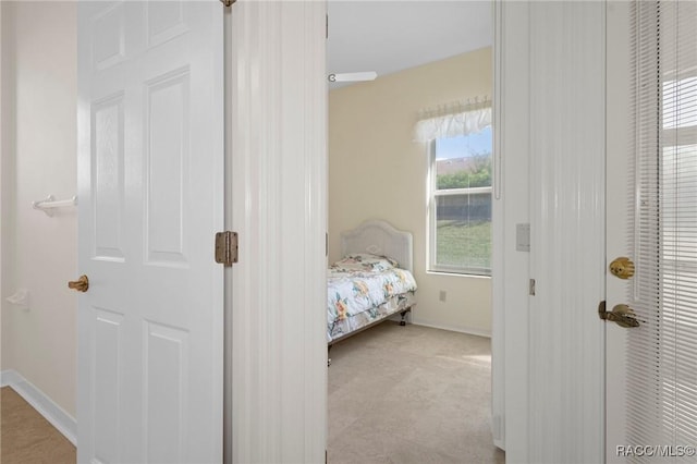 bedroom featuring light colored carpet