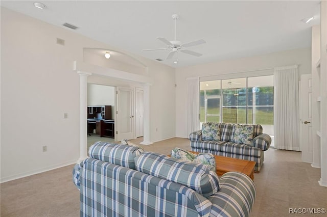 living room featuring decorative columns and ceiling fan