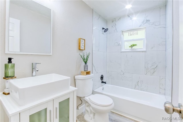 full bathroom featuring shower / bathtub combination, toilet, and vanity