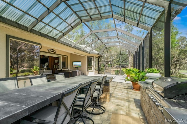 sunroom / solarium featuring lofted ceiling