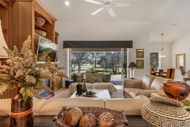 living room with a ceiling fan and wood finished floors