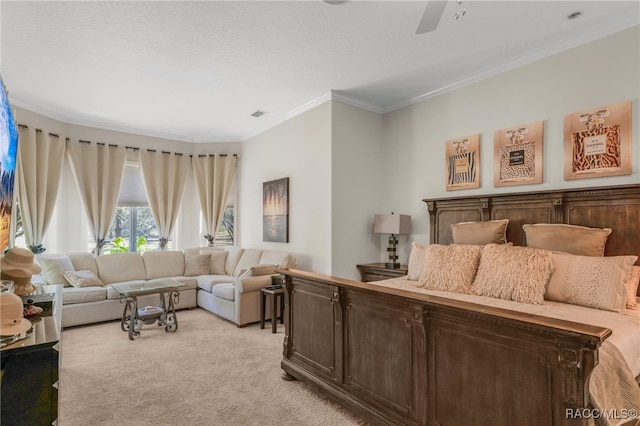 bedroom featuring crown molding, a ceiling fan, visible vents, and light carpet