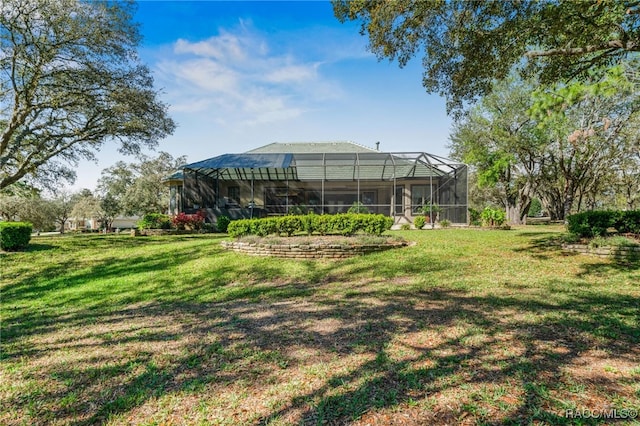 view of yard with glass enclosure