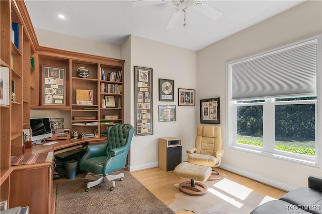 office with wood finished floors, baseboards, and ceiling fan