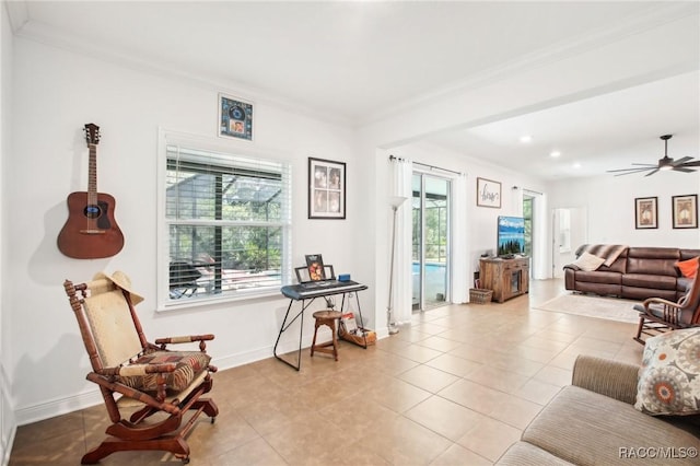 tiled living room featuring crown molding, plenty of natural light, and ceiling fan