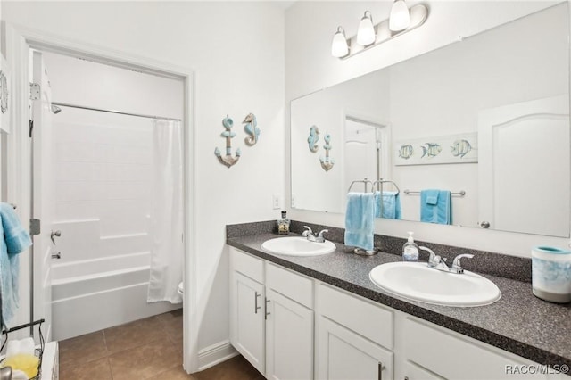 bathroom with tile patterned flooring, vanity, and shower / bathtub combination with curtain