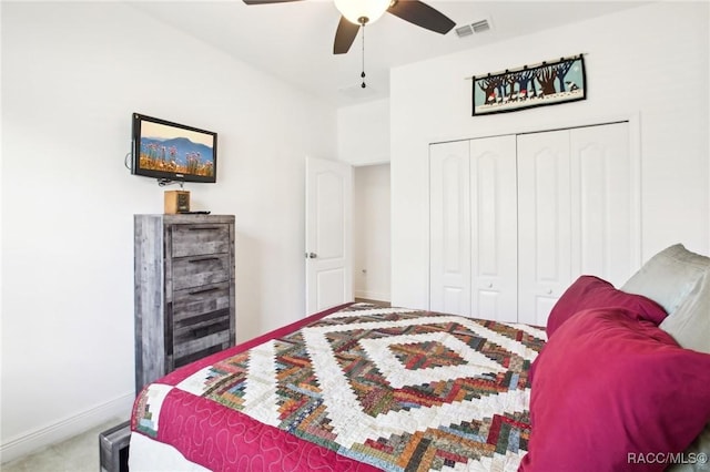 bedroom featuring ceiling fan, carpet floors, and a closet