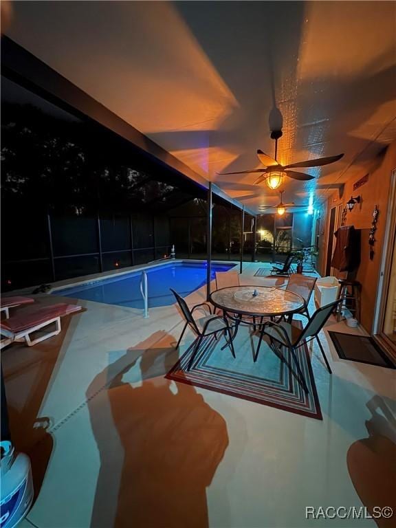 view of swimming pool featuring ceiling fan