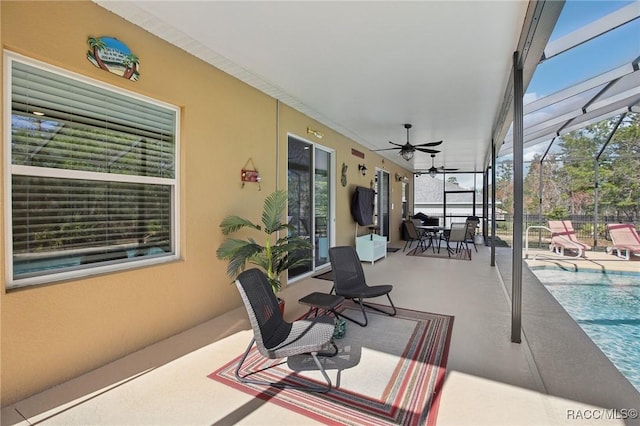 view of patio / terrace featuring glass enclosure