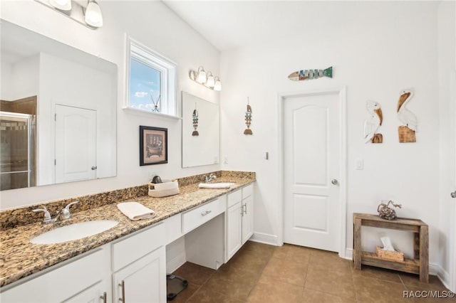 bathroom featuring tile patterned flooring, vanity, and an enclosed shower