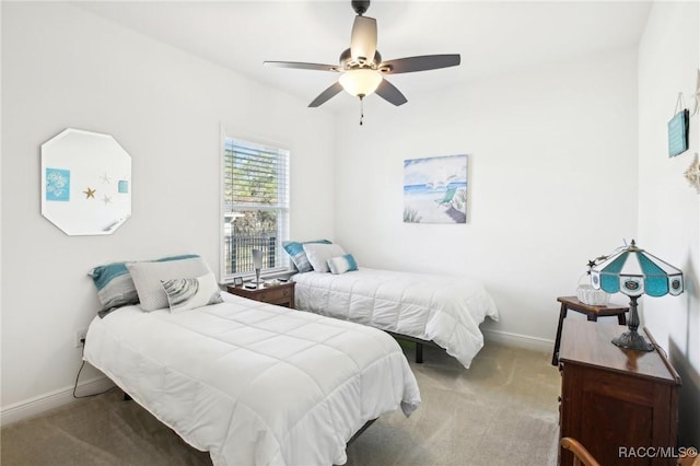 bedroom with ceiling fan and carpet flooring