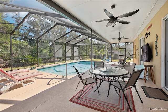 view of swimming pool with a lanai, a patio, and ceiling fan