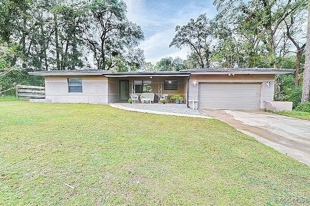 view of front facade with a garage and a front lawn