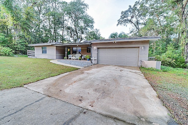 single story home with a front lawn and a garage