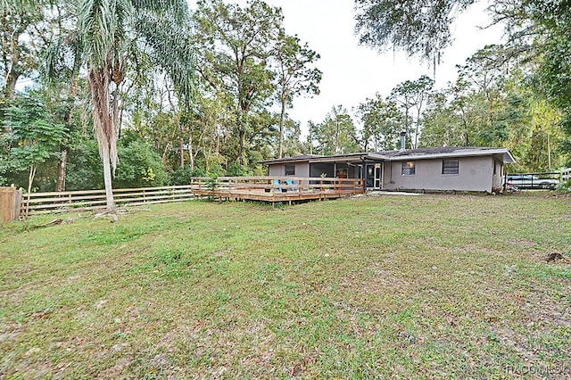 view of yard with a deck