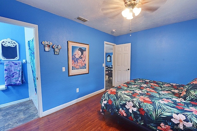 bedroom featuring ceiling fan and hardwood / wood-style floors