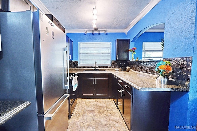 kitchen featuring decorative backsplash, black range with electric stovetop, ornamental molding, sink, and stainless steel refrigerator