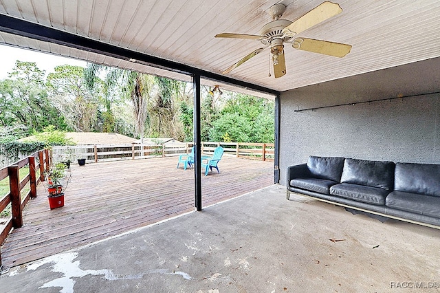 interior space featuring a wooden deck and ceiling fan