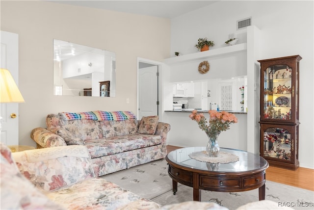 living room with light hardwood / wood-style floors