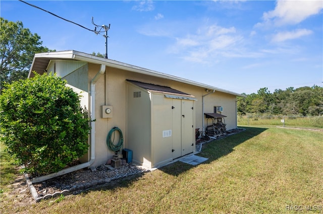 view of property exterior with a lawn